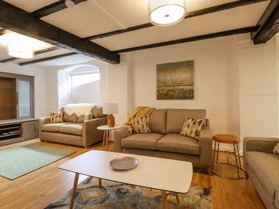 Two sofas and a low table at the dining end of the living space